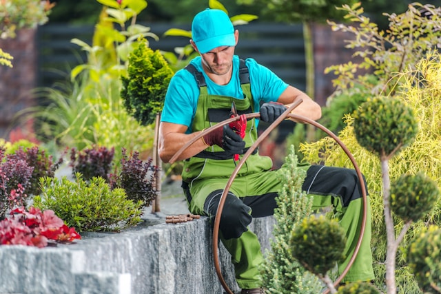 men-building-garden-irrigation-watering-system