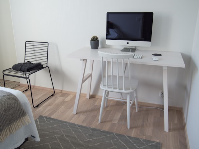 white-wooden-table-with-black-flat-screen-tv